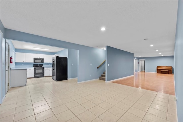 unfurnished living room featuring light tile patterned floors