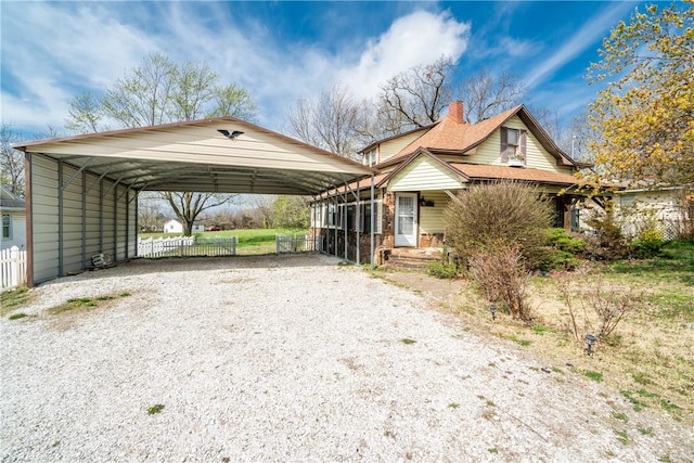 view of front of home featuring a carport