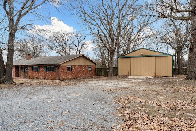 view of side of home with an outbuilding