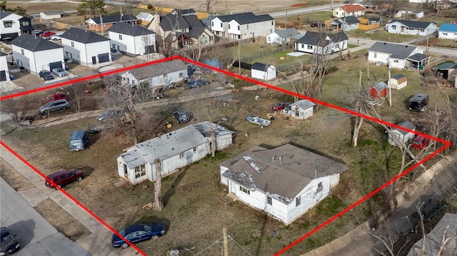 birds eye view of property with a residential view
