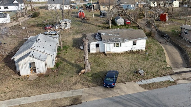 birds eye view of property with a residential view