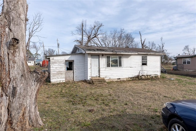 ranch-style home with a front yard