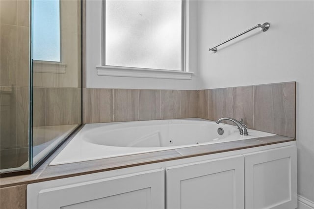 bathroom with a whirlpool tub