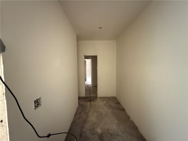 hallway with concrete floors