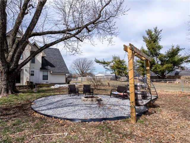 view of yard with an outdoor fire pit and a fenced backyard