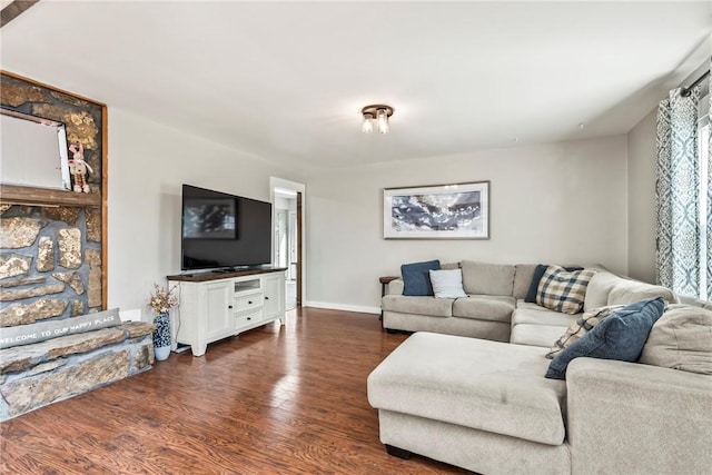 living room with baseboards and dark wood-type flooring