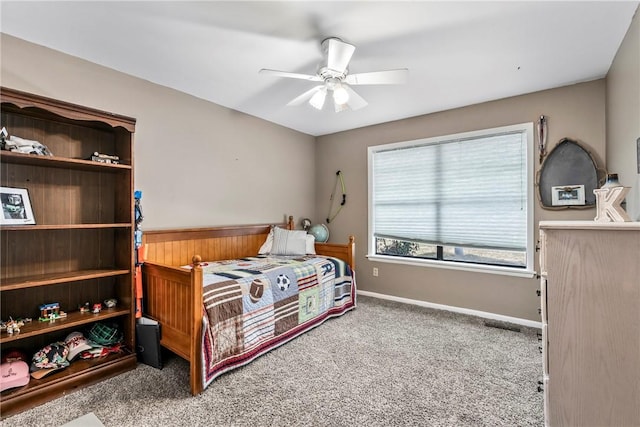 bedroom with a ceiling fan, carpet, and baseboards