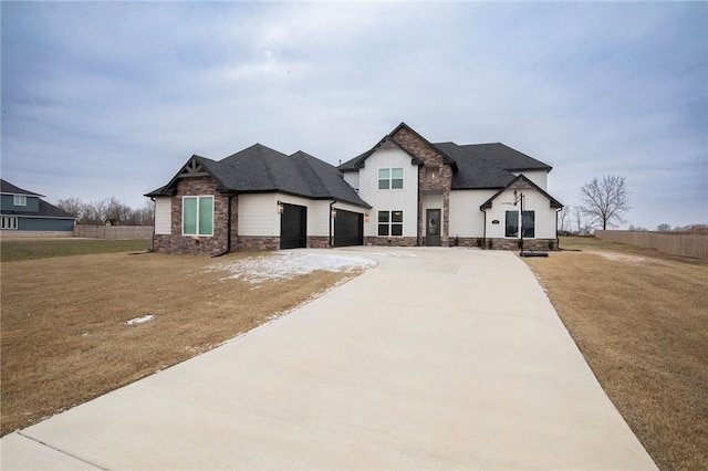 view of front of house with a garage and a front yard