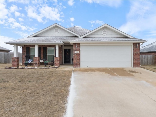 view of front of home featuring a garage and a porch