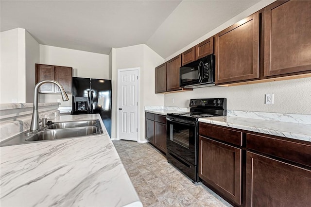 kitchen featuring sink, vaulted ceiling, black appliances, and dark brown cabinets