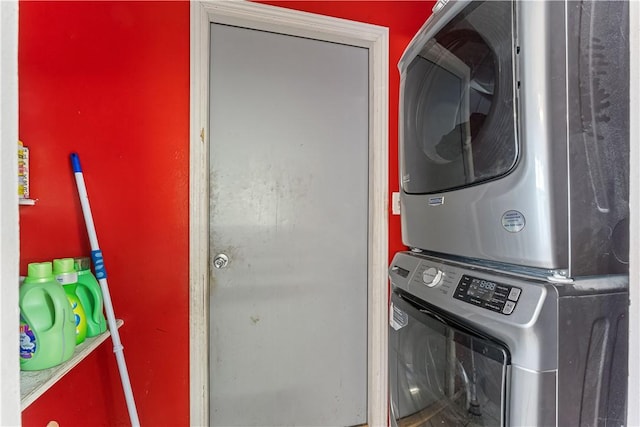 laundry room featuring laundry area and stacked washer and clothes dryer