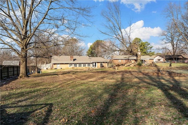 view of yard featuring a residential view and fence