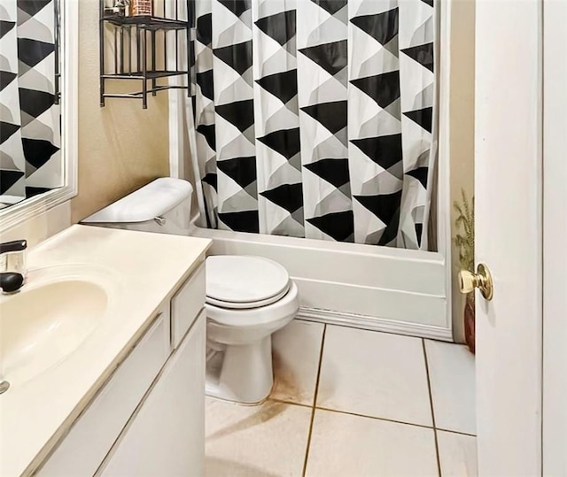 bathroom featuring toilet, tile patterned flooring, shower / bath combo with shower curtain, and vanity