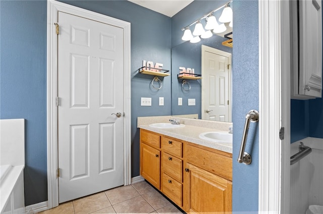 full bath featuring double vanity, a sink, and tile patterned floors