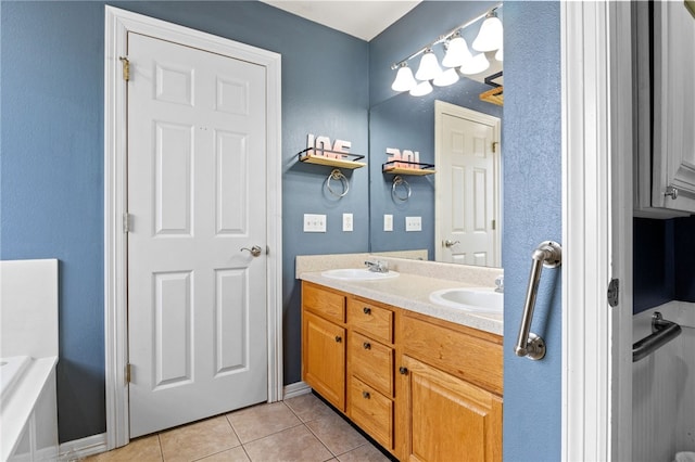 bathroom featuring double vanity, a sink, and tile patterned floors