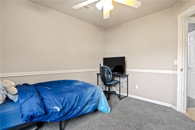 carpeted bedroom with ceiling fan, visible vents, and baseboards