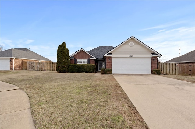 ranch-style home with a garage, brick siding, fence, concrete driveway, and a front lawn