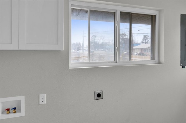 clothes washing area with washer hookup and hookup for an electric dryer