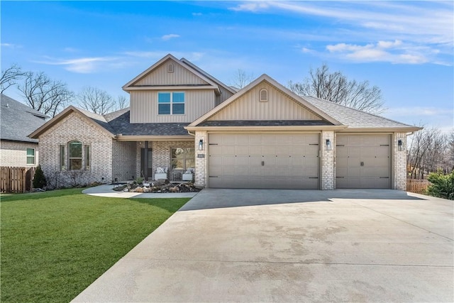 view of front of home featuring driveway, a front lawn, fence, a garage, and brick siding