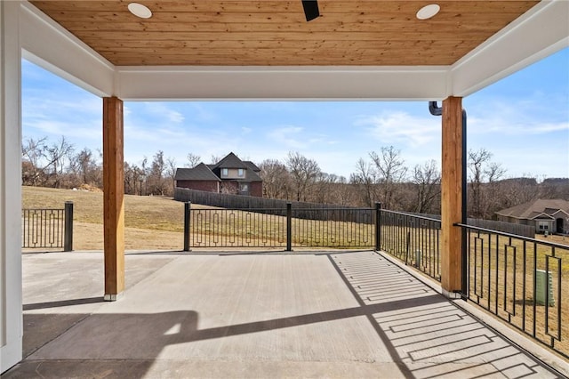 view of patio / terrace with a ceiling fan and fence