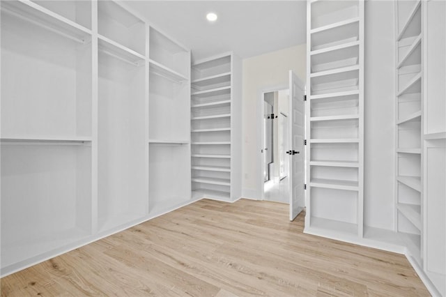 walk in closet featuring light wood-style flooring