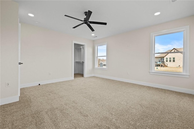 unfurnished bedroom featuring carpet and baseboards