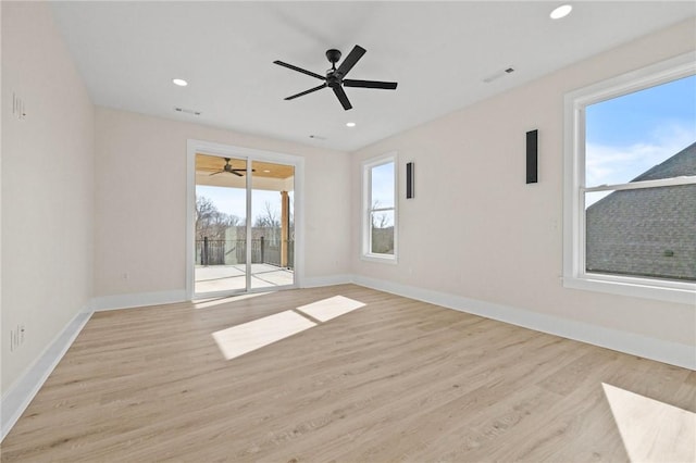 empty room with recessed lighting, baseboards, and light wood finished floors