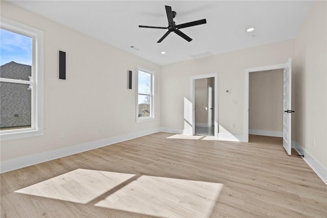 unfurnished bedroom featuring light wood-type flooring, baseboards, and recessed lighting