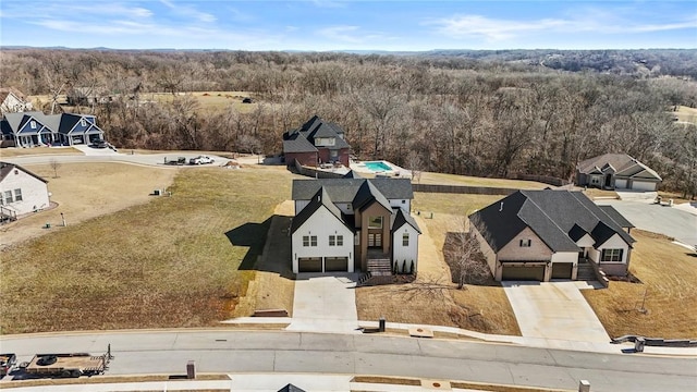 birds eye view of property with a residential view