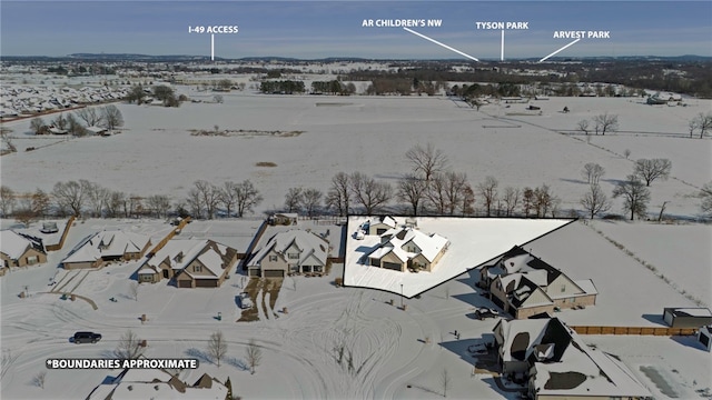 snowy aerial view featuring a residential view