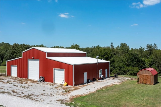 view of outbuilding featuring a forest view and an outdoor structure