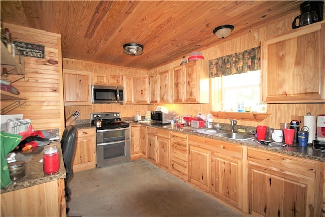 kitchen with wooden walls, dark countertops, stainless steel appliances, open shelves, and a sink