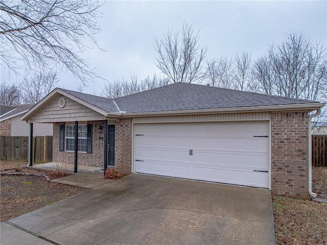 single story home with an attached garage, brick siding, a shingled roof, fence, and driveway