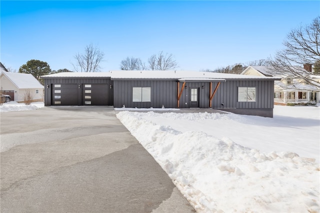 view of front of property with a garage and board and batten siding