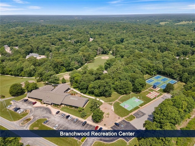 drone / aerial view featuring a forest view