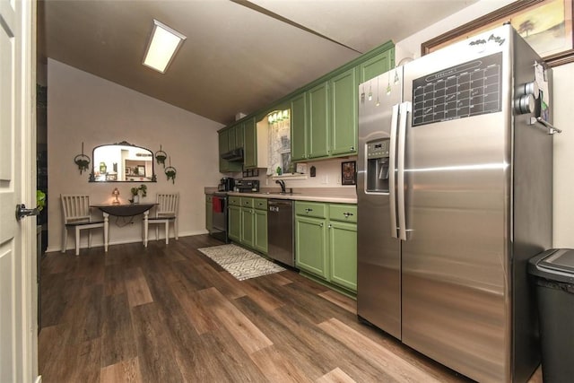 kitchen with green cabinets, stainless steel appliances, a sink, and light countertops