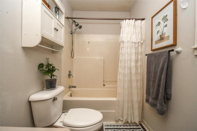 full bathroom featuring shower / bath combination with curtain and toilet