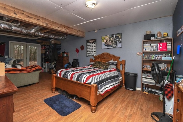 bedroom with wood finished floors