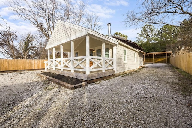 view of property exterior featuring fence