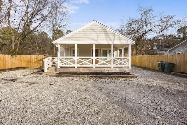 view of outbuilding with fence