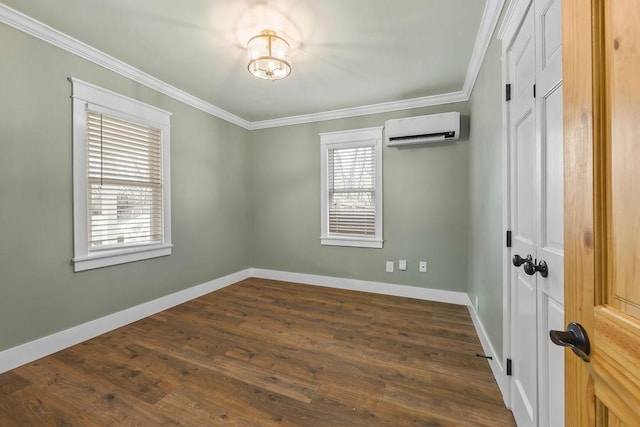 empty room featuring baseboards, dark wood finished floors, crown molding, and a wall mounted air conditioner