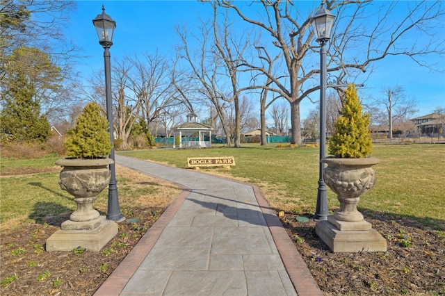 exterior space with a gazebo and a lawn