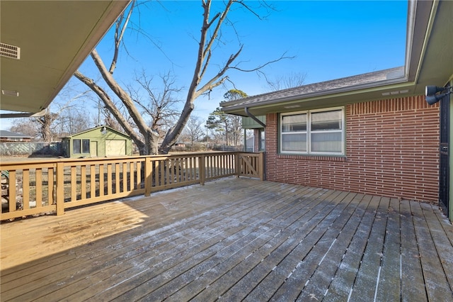 deck with an outbuilding and a storage shed