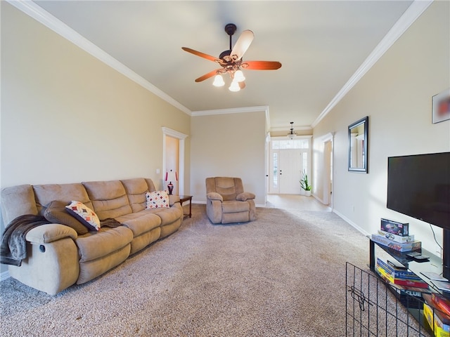 living room with baseboards, carpet floors, a ceiling fan, and crown molding