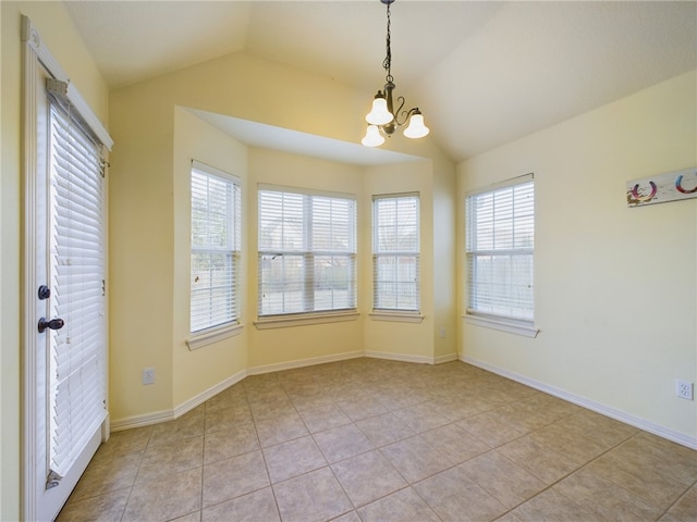 unfurnished dining area with lofted ceiling, light tile patterned floors, a chandelier, and baseboards