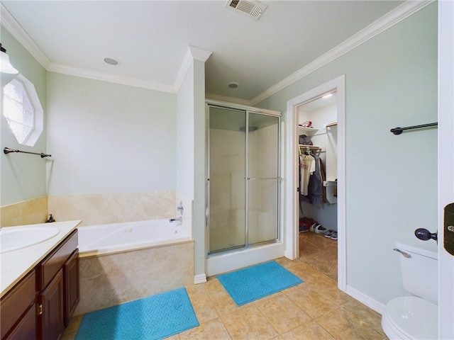 bathroom featuring visible vents, a walk in closet, a bath, and ornamental molding