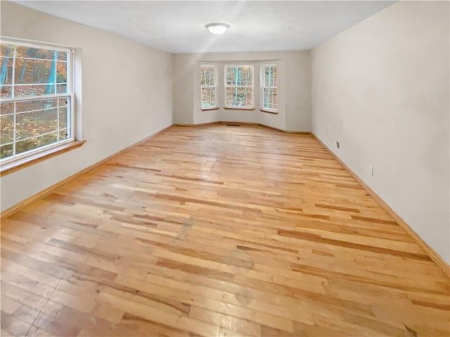 unfurnished room featuring light wood-style flooring