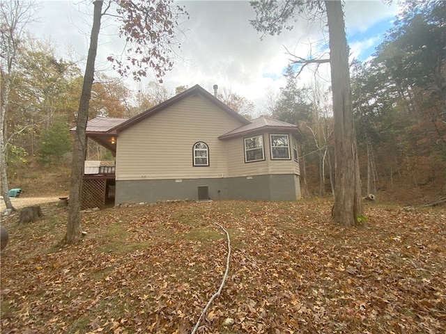 view of side of property with crawl space