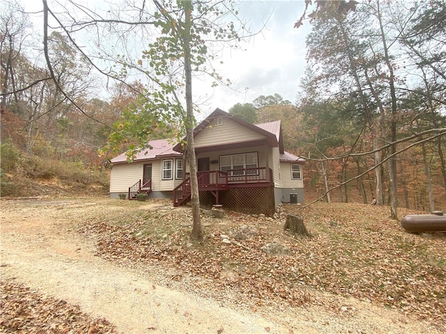 rear view of property featuring entry steps