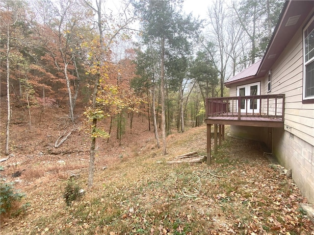 view of yard featuring a wooden deck